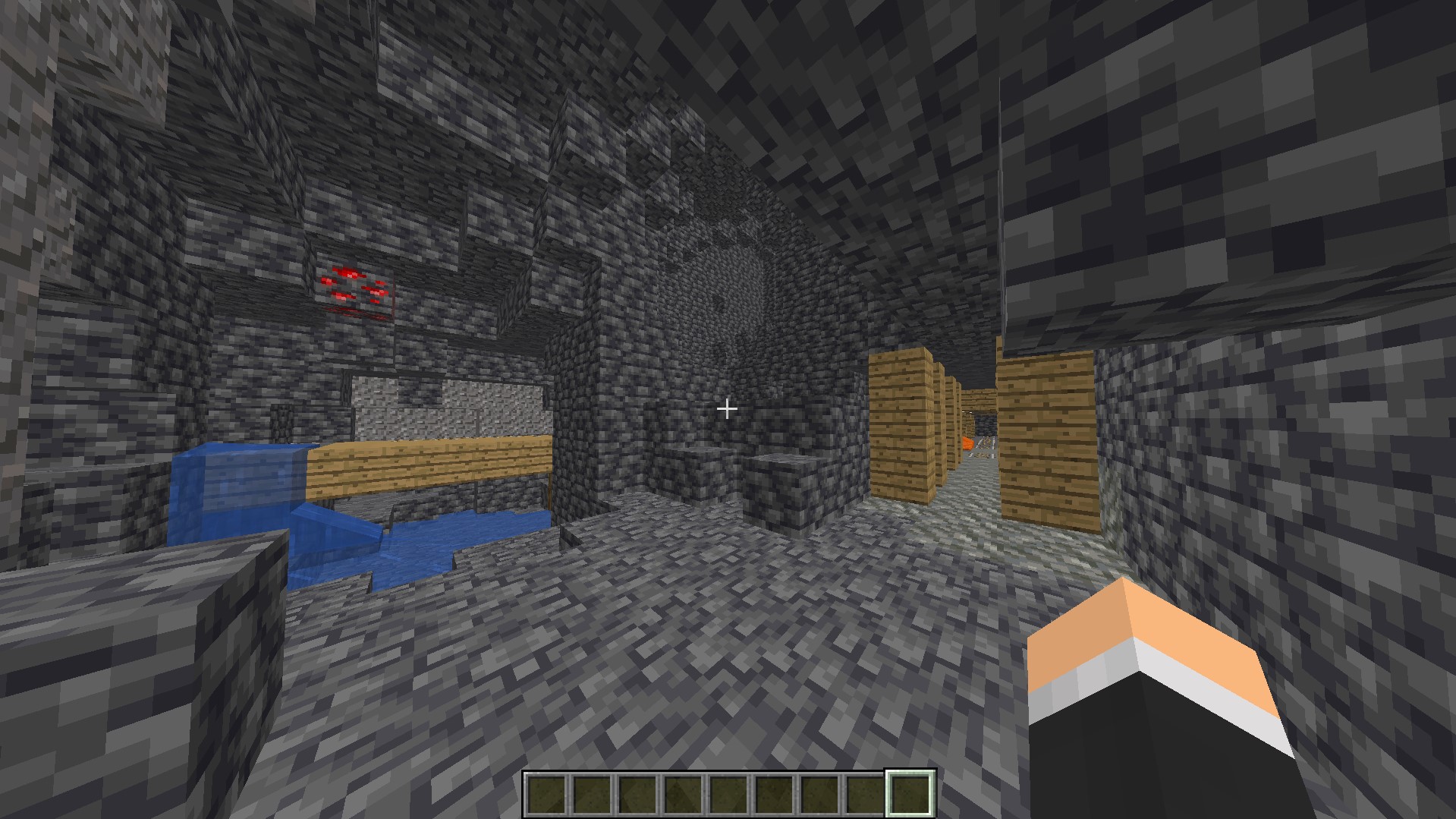 In game in Minecraft showing a cave